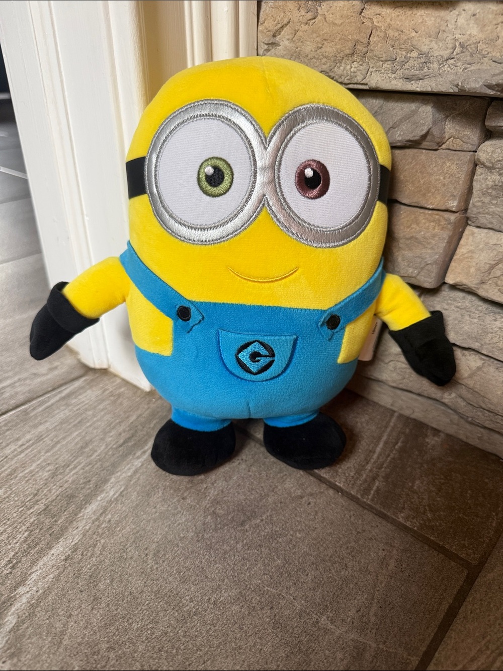 Universal Yellow Plush Character with Blue Overalls and Black Accents